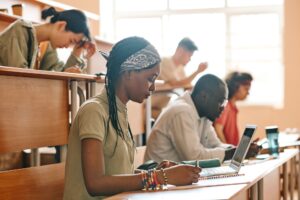 Students writing exam at university